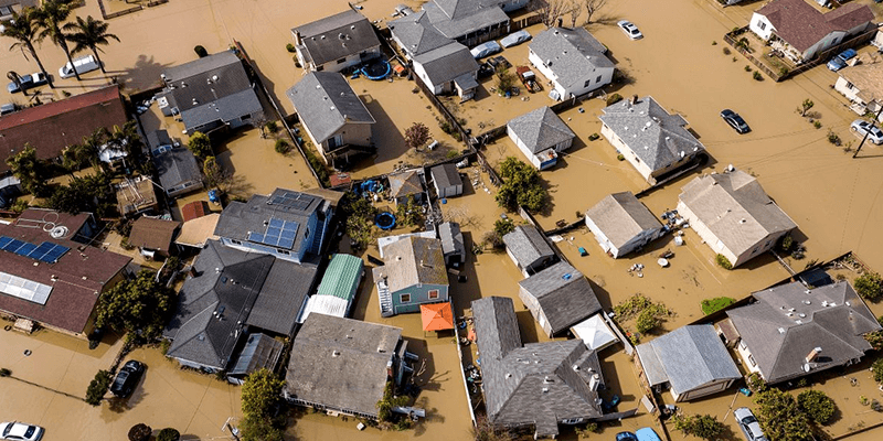 Muddy street blocked by debris after rain-induced mudslide in California